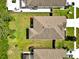 Aerial view of a well-maintained home with a grassy backyard and neighboring properties at 12428 Chaya Ct, Spring Hill, FL 34610