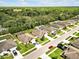 Aerial view showcases homes nestled within lush greenery and a serene neighborhood at 12428 Chaya Ct, Spring Hill, FL 34610
