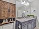 Updated bathroom showcases cabinets, granite countertops and decorative accents at 12428 Chaya Ct, Spring Hill, FL 34610