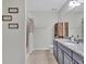Neutral bathroom featuring granite countertops and a shower-tub combo at 12428 Chaya Ct, Spring Hill, FL 34610