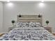 Comfortable bedroom features stylish headboard, decorative pillows, and matching nightstands at 12428 Chaya Ct, Spring Hill, FL 34610