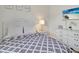 Cozy bedroom with updated flooring and neutral decor with TV for entertainment at 12428 Chaya Ct, Spring Hill, FL 34610