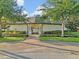 Welcoming community entrance with manicured landscaping and architectural details at 12428 Chaya Ct, Spring Hill, FL 34610