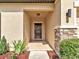 Welcoming entryway with decorative wreath and stone pillar accent at 12428 Chaya Ct, Spring Hill, FL 34610