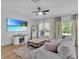 Cozy living area featuring shiplap wall, soft seating, and natural light at 12428 Chaya Ct, Spring Hill, FL 34610