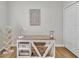 Cozy office setup featuring a wooden desk, a bookshelf, and natural light at 12428 Chaya Ct, Spring Hill, FL 34610