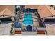 Aerial view of the backyard of the property showing the screened-in pool and covered patio at 13544 Avista Dr, Tampa, FL 33624