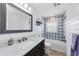Modern bathroom featuring tile surround, a single sink vanity, and updated fixtures at 13544 Avista Dr, Tampa, FL 33624