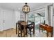 Cozy dining area with modern lighting, an adjacent bar, and direct access to the patio and pool at 13544 Avista Dr, Tampa, FL 33624