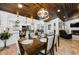Open floor plan showing dining room leading into a kitchen with a wood ceiling at 13544 Avista Dr, Tampa, FL 33624