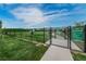Community dog park rules and regulations sign with entry gate at 13544 Avista Dr, Tampa, FL 33624