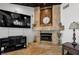 Close-up of the stone fireplace in the living room with travertine floors at 13544 Avista Dr, Tampa, FL 33624