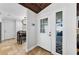 Inviting foyer featuring decorative tile flooring, with view to dining area and view through the glass paneled front door at 13544 Avista Dr, Tampa, FL 33624