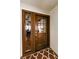 Inviting front door featuring glass panels and a stylish rug that welcomes guests at 13544 Avista Dr, Tampa, FL 33624