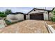 Charming single-Gathering home with a brick driveway and a two-car garage at 13544 Avista Dr, Tampa, FL 33624