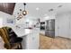Updated kitchen with stainless steel appliances, white cabinets, and stone countertops at 13544 Avista Dr, Tampa, FL 33624