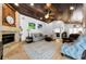 Living room with wood ceiling, stone fireplace, travertine floors, and neutral decor at 13544 Avista Dr, Tampa, FL 33624
