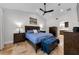 Cozy main bedroom featuring a ceiling fan and ensuite access to the bathroom and shower at 13544 Avista Dr, Tampa, FL 33624
