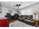 Cozy home office featuring a ceiling fan, hardwood floors, and comfortable seating at 13544 Avista Dr, Tampa, FL 33624