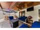 Relaxing covered patio includes a fire pit and an outdoor television for cozy evenings at 13544 Avista Dr, Tampa, FL 33624