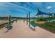 Community playground and workout area with a view of the lake at 13544 Avista Dr, Tampa, FL 33624