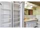 Bathroom with ample storage, vanity, and updated fixtures at 1436 Santa Clara Dr, Dunedin, FL 34698