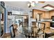 Open dining area with a view into the kitchen and an inviting seating area, creating a warm atmosphere at 1436 Santa Clara Dr, Dunedin, FL 34698
