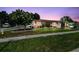 Well maintained traditional single Gathering home featuring mature trees and lush landscaping on a corner lot at 1436 Santa Clara Dr, Dunedin, FL 34698