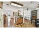 Kitchen featuring wood cabinetry and an open design that connects to the dining and living areas at 1436 Santa Clara Dr, Dunedin, FL 34698
