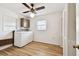 Laundry area with a washer, dryer, storage shelves, and closet for organization at 1436 Santa Clara Dr, Dunedin, FL 34698