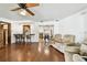 Open-concept living room with wood floors, breakfast bar, and cozy seating area at 1436 Santa Clara Dr, Dunedin, FL 34698