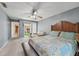 Spacious bedroom with a sitting area, a view of the backyard, and natural light at 15005 Roundup Dr, Tampa, FL 33624