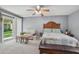 Bedroom featuring a seating area and a sliding glass door to the outside at 15005 Roundup Dr, Tampa, FL 33624