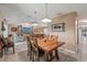 Open-concept dining area with pendant lights and easy access to the living room at 15005 Roundup Dr, Tampa, FL 33624