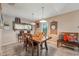 Cozy dining room with modern pendant lighting, wood table, and tiled floors at 15005 Roundup Dr, Tampa, FL 33624