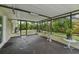 Large screened lanai with room for seating and views of the landscaped backyard at 15005 Roundup Dr, Tampa, FL 33624