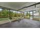 Screened lanai offering views of the lush backyard and the sparkling pool area at 15005 Roundup Dr, Tampa, FL 33624