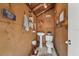 Unique powder room with quirky decor, a pedestal sink, and rustic charm at 15005 Roundup Dr, Tampa, FL 33624