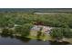 Aerial shot of the property showcasing its lakefront location and surrounding landscape at 16112 N 15Th St, Lutz, FL 33549