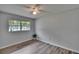 This bedroom has ample natural light and modern flooring at 16112 N 15Th St, Lutz, FL 33549