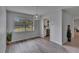 Bright dining room with a large window and modern light fixture at 16112 N 15Th St, Lutz, FL 33549