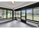 Enclosed lanai with views to the backyard and pond at 16112 N 15Th St, Lutz, FL 33549