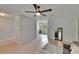 Cozy living room with tile flooring, ceiling fan, and an open layout leading to other areas of the home at 16112 N 15Th St, Lutz, FL 33549