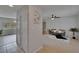 Open concept living space features tile floors, neutral tones, ceiling fan, and ample natural light at 16112 N 15Th St, Lutz, FL 33549