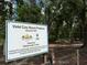 Sign for Violet Cury Nature Preserve, acquired in 1995, with lush greenery nearby at 16112 N 15Th St, Lutz, FL 33549