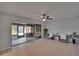 Relaxing sunroom with tile floors, ceiling fan, and sliders to additional screened lanai at 16112 N 15Th St, Lutz, FL 33549