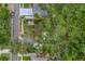Aerial view showing property boundaries and surrounding lush greenery at 1753 San Mateo Dr, Dunedin, FL 34698