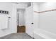 Clean bathroom with white subway tile, a shower, and a towel rack at 1753 San Mateo Dr, Dunedin, FL 34698