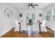 Bright dining room featuring a modern table setting, neutral decor, and natural light from outdoor at 1753 San Mateo Dr, Dunedin, FL 34698
