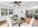 Sun-drenched dining area leads to kitchen, creating functional design ideal for entertaining guests at 1753 San Mateo Dr, Dunedin, FL 34698